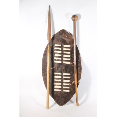 1889 - Zulu hide shield of typical form, a Zulu throwing spear and a large knobkerrie war club, 72cm, 96cm ... 