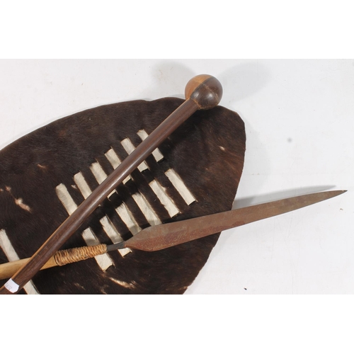 1889 - Zulu hide shield of typical form, a Zulu throwing spear and a large knobkerrie war club, 72cm, 96cm ... 