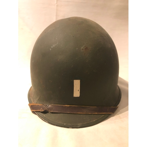 1895 - American WWII style steel helmet with painted decoration in the form of two white spades suggesting ... 