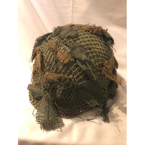 1896 - American M1 style helmet having camouflage cover and netting, Capac liner, with leather headband and... 