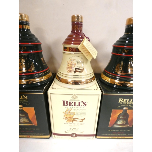 3 - Four bottles of Bell's blended Scotch whisky to include Christmas 1994, 1997, 1993 and 1995, each 40... 