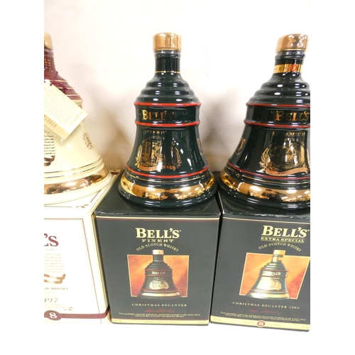 3 - Four bottles of Bell's blended Scotch whisky to include Christmas 1994, 1997, 1993 and 1995, each 40... 