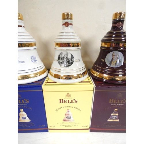 4 - Four bottles of Bell's blended Scotch whisky to include Christmas 2001, 2005, 2002 and 1998, each 40... 