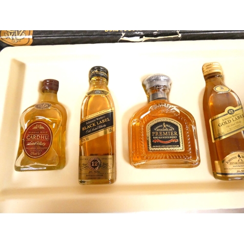 9 - Johnnie Walker. Two boxed 5cl 40% ABV whisky miniature selections to include gold label, premier and... 