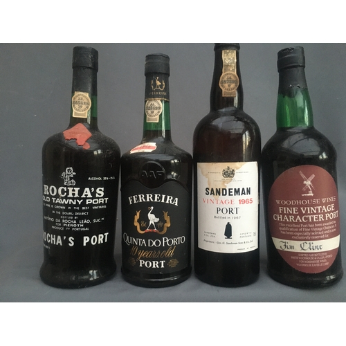 127 - Four bottles of vintage port to include SANDEMAN 1965, bottled in 1967, 75cl no abv. stated, WOODHOU... 