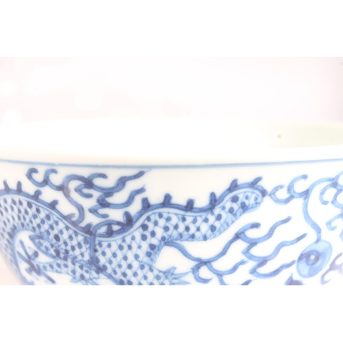 341 - Chinese porcelain dragon bowl, late Qing Guangxu period, the body decorated in underglaze blue with ... 