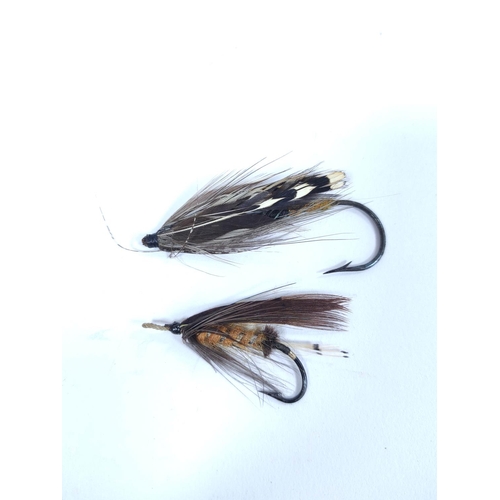 386 - Salmon Flies.  Ebonised glazed case of approximately 115 vintage salmon flies, in two sizes, many wi... 