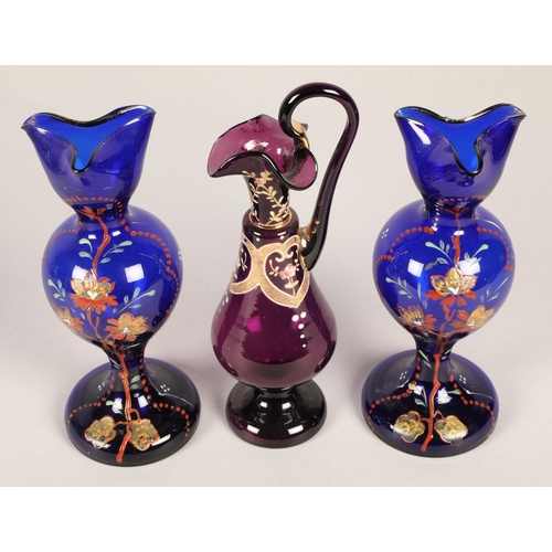 12 - Pair of blue glass painted vases and a purple in the form of a ewer (3)