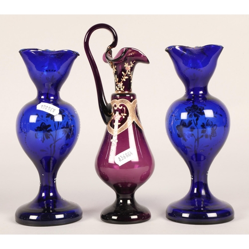 12 - Pair of blue glass painted vases and a purple in the form of a ewer (3)