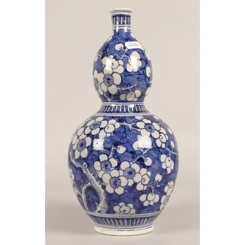 15 - Gourd shaped blue and white oriental vase, 32cm h