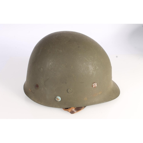 1895 - American WWII style steel helmet with painted decoration in the form of two white spades suggesting ... 