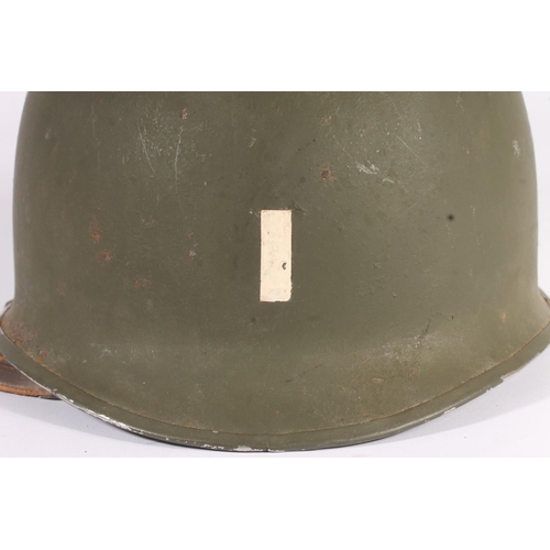 1895 - American WWII style steel helmet with painted decoration in the form of two white spades suggesting ... 