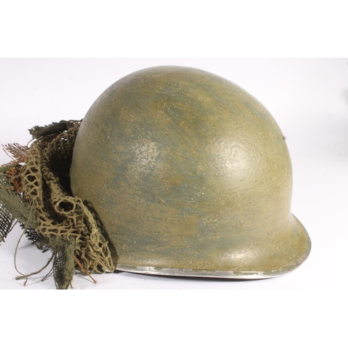 1896 - American M1 style helmet having camouflage cover and netting, Capac liner, with leather headband and... 