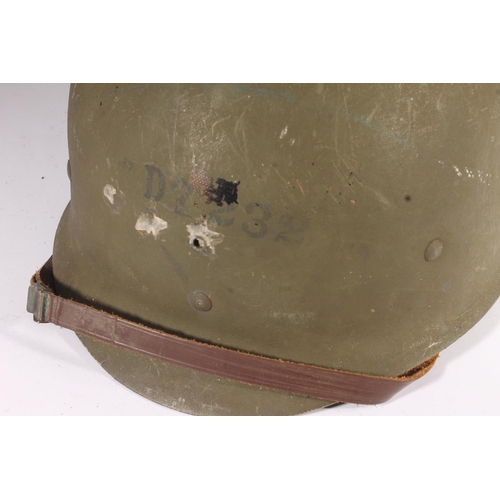 1896 - American M1 style helmet having camouflage cover and netting, Capac liner, with leather headband and... 