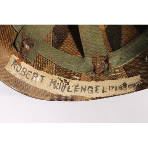 1897 - American M1 style steel helmet having camouflage cover, canvas webbing, the liner marked 'Robert Kuh... 