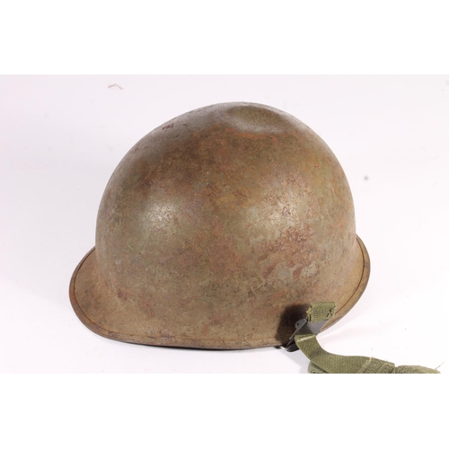 1898 - American M1 style steel helmet having camouflage cover, liner, canvas webbing, and leather headband.