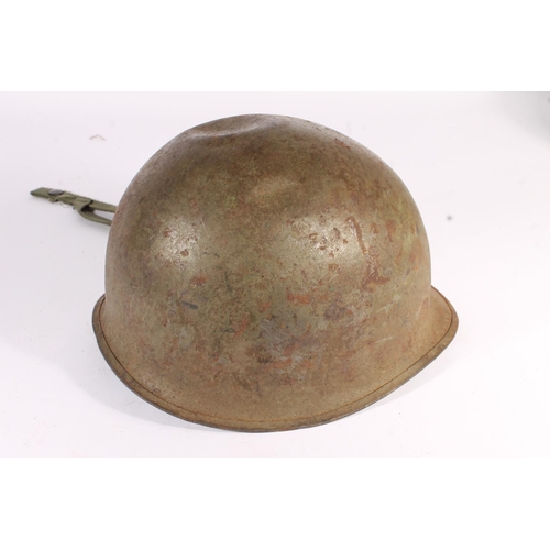 1898 - American M1 style steel helmet having camouflage cover, liner, canvas webbing, and leather headband.