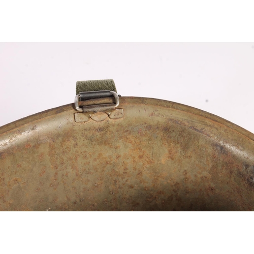 1898 - American M1 style steel helmet having camouflage cover, liner, canvas webbing, and leather headband.