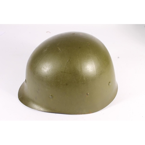 1898 - American M1 style steel helmet having camouflage cover, liner, canvas webbing, and leather headband.