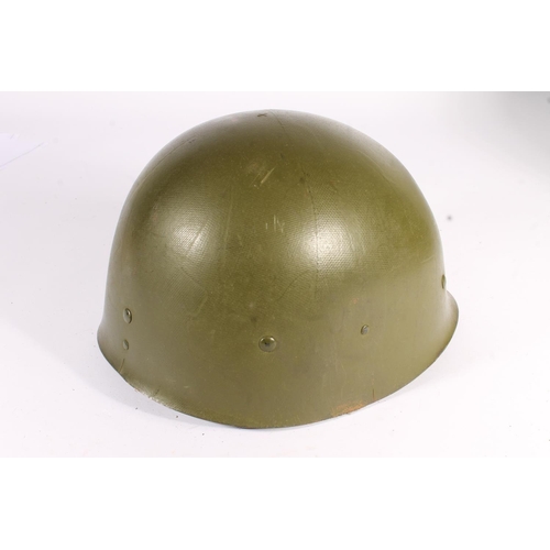 1898 - American M1 style steel helmet having camouflage cover, liner, canvas webbing, and leather headband.