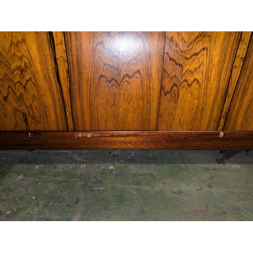 427 - A.H.McIntosh of Kirkcaldy retro sideboard with pair of cupboard doors flanked by three drawers and a... 