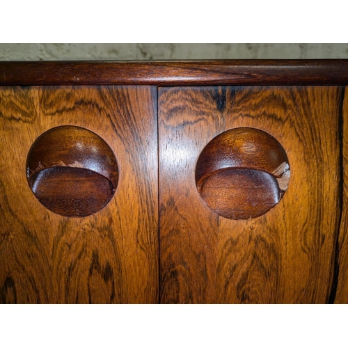 427 - A.H.McIntosh of Kirkcaldy retro sideboard with pair of cupboard doors flanked by three drawers and a... 