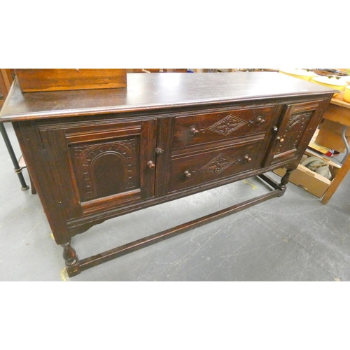 174 - Large Priory style dark oak sideboard.