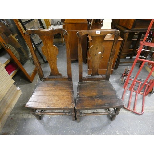 175 - Two 18th century oak dining chairs.