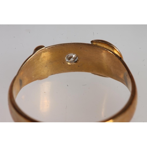 700 - Diamond set yellow metal ring in the form of a belt, possibly stamped 18ct.