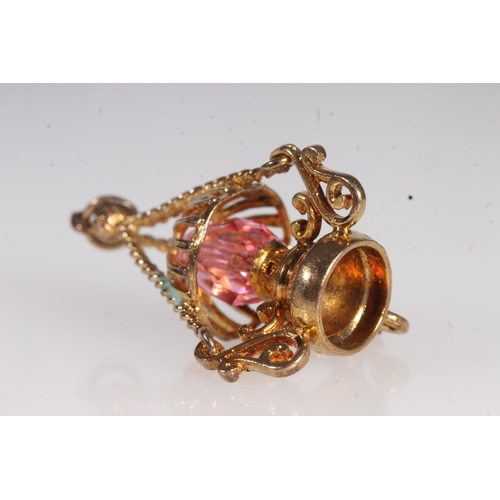 710 - 9ct gold pink stone set pendant in the form of a lantern, 4.9g.