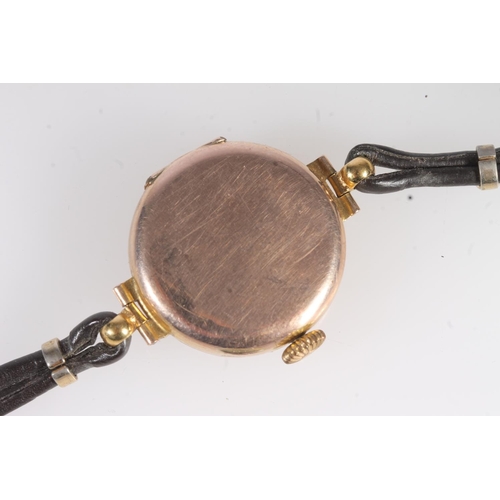 724 - 9ct gold cased ladies wristwatch on antique leather strap.