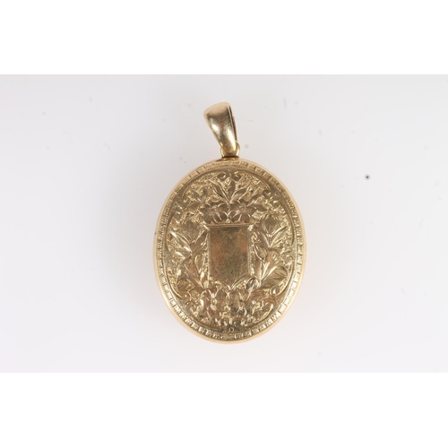 730 - Gold Victorian mourning locket with floral decoration and cross, 11.9g.