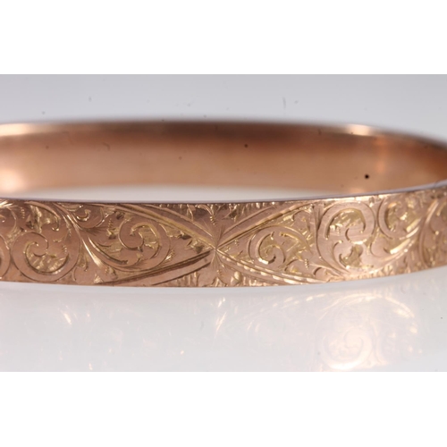 736 - Victorian 9ct gold floral decorated snap shut bangle, 11.8g.