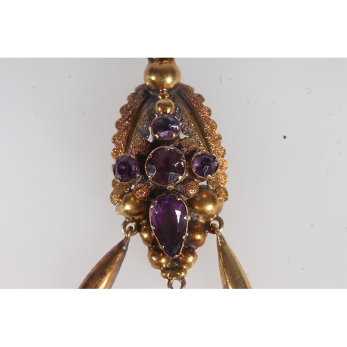 746 - Yellow metal necklace with amethyst set pendant.