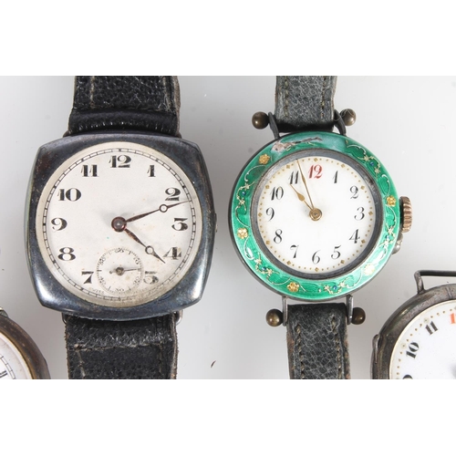 751 - Four silver cased watches to include an enamelled silver watch, a silver military wristwatch, etc.  ... 