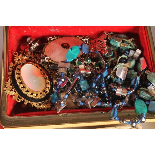 752 - Box containing costume jewellery, a coral bead necklace, brooches etc.