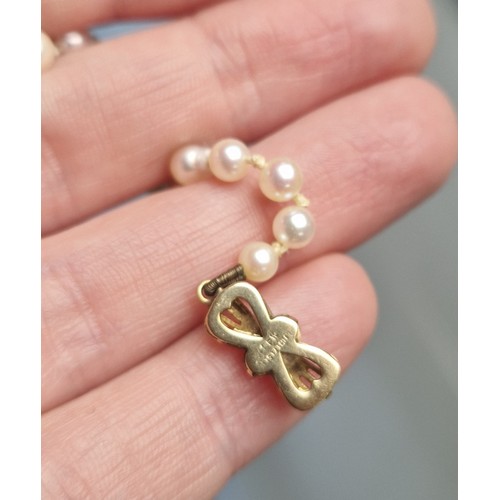 60A - String of pearls on 9ct gold clasp,