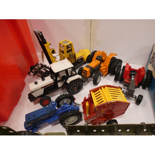 29 - Carton containing diecast and other vehicles to include tractors, farm machinery, plant etc.