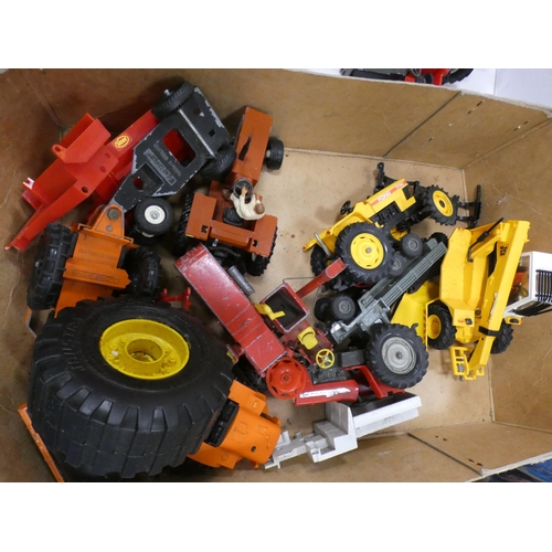 29 - Carton containing diecast and other vehicles to include tractors, farm machinery, plant etc.