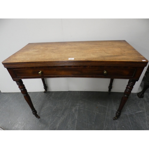 474 - 19th century mahogany fold-over tea table with frieze drawer, on turned supports and castors, 102cm ... 