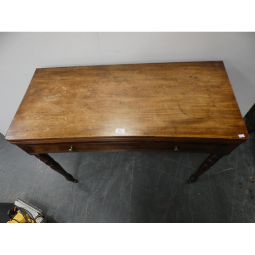 474 - 19th century mahogany fold-over tea table with frieze drawer, on turned supports and castors, 102cm ... 