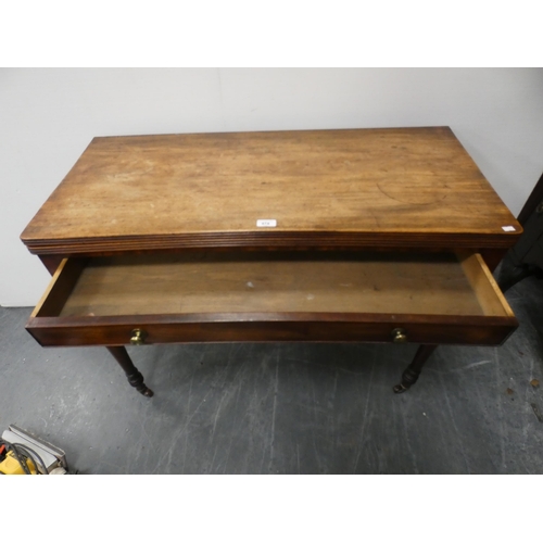 474 - 19th century mahogany fold-over tea table with frieze drawer, on turned supports and castors, 102cm ... 