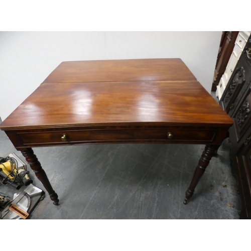 474 - 19th century mahogany fold-over tea table with frieze drawer, on turned supports and castors, 102cm ... 