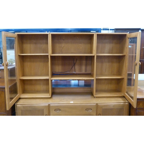 476 - Ercol blonde ash and elm dresser, the display top section with open shelving to the centre flanked b... 