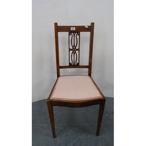 485 - Mahogany and crossbanded side chair with pierced fretwork splat, on square tapering supports.