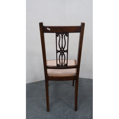 485 - Mahogany and crossbanded side chair with pierced fretwork splat, on square tapering supports.