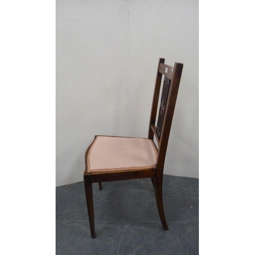 485 - Mahogany and crossbanded side chair with pierced fretwork splat, on square tapering supports.