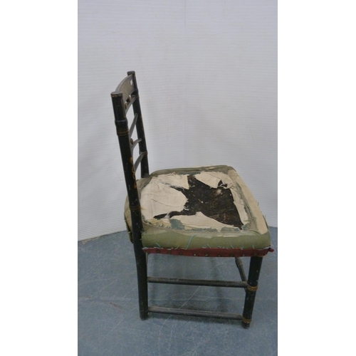 486 - Antique ebonised parlour chair with gilt-painted decoration, on turned supports.