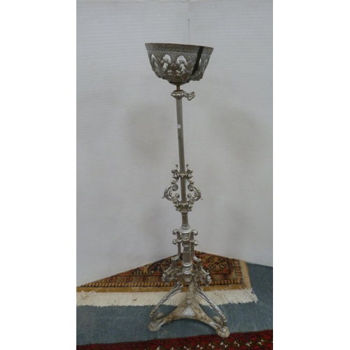 488 - Wrought iron silver-coloured candle holder, 110cm high.