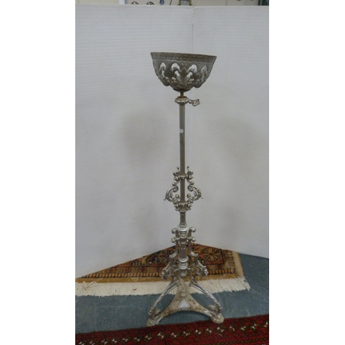 488 - Wrought iron silver-coloured candle holder, 110cm high.